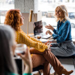 women-talking-in-the-office