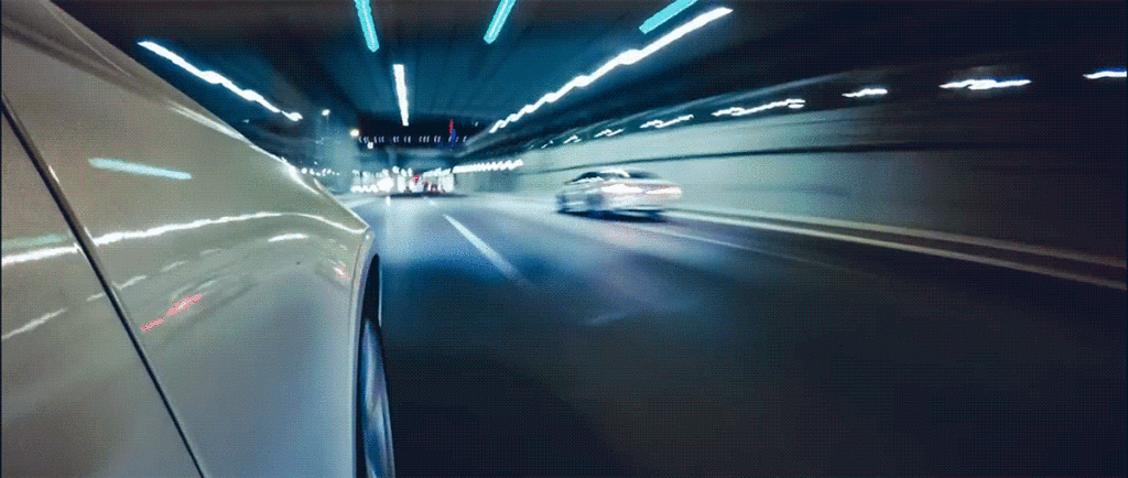 A car driving through a city tunnel to represent JB helping clients navigate healthcare digital marketing solutions